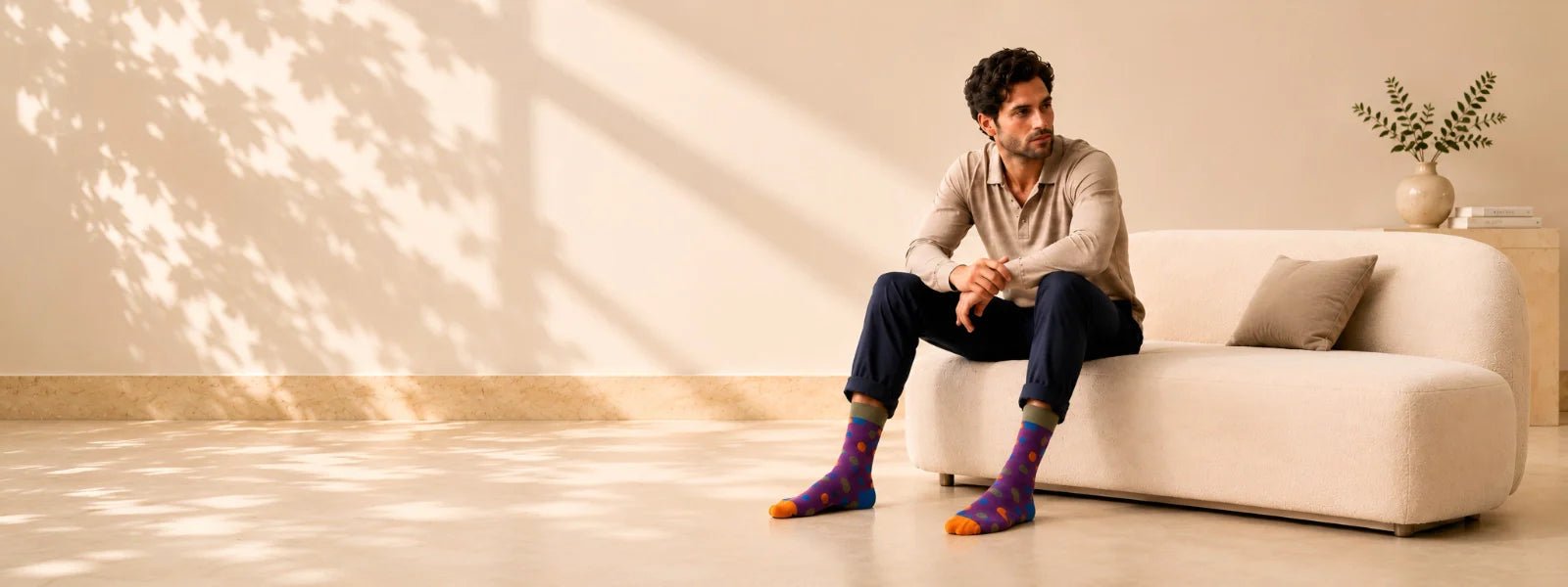 Man wearing colourful cotton socks in a premium lifestyle setting | Uniq Socks Australia