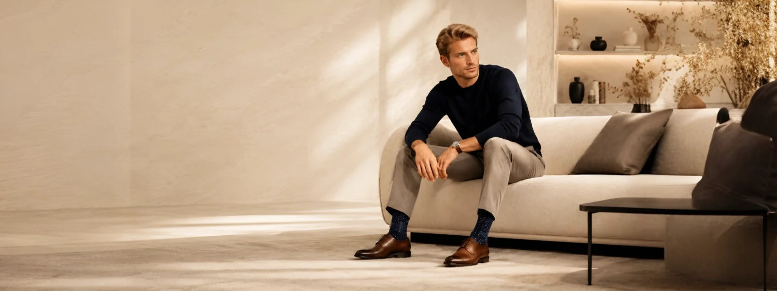 Man wearing navy dress socks with leather shoes in a luxury lifestyle setting | Uniq Socks Australia