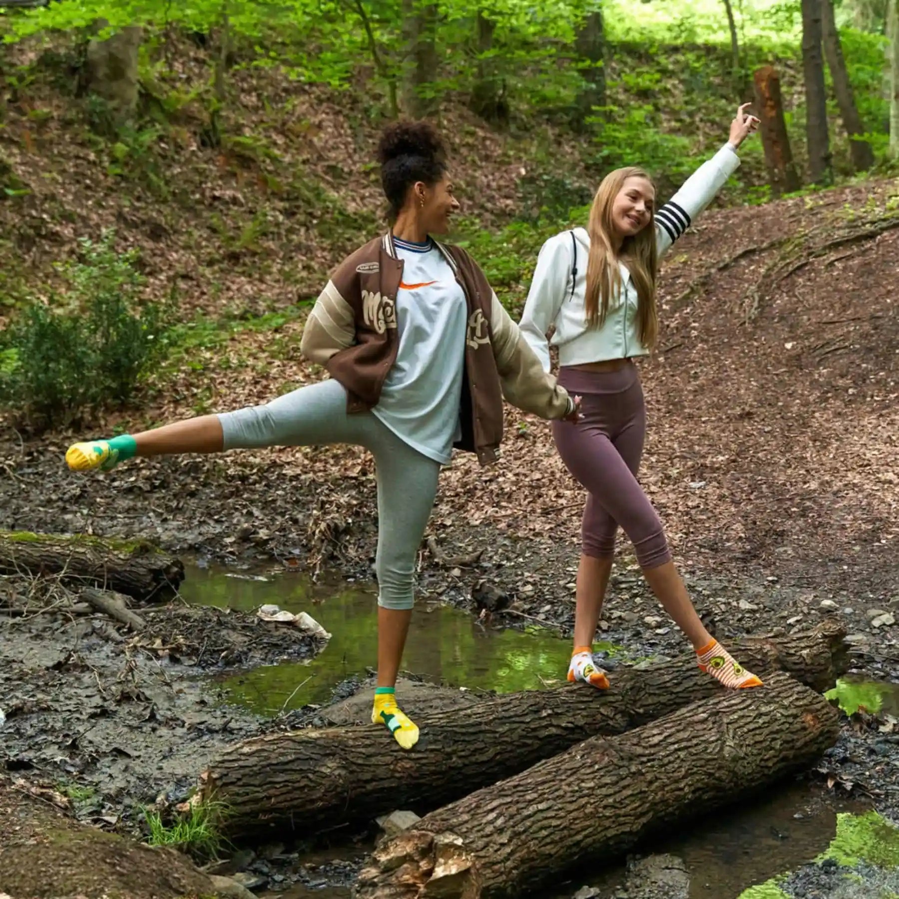 person wearing yellow and green ankle socks with spring leaves
