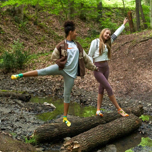 Person wearing white and orange ankle socks with cute avocado image