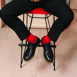 Man wearing red and black bamboo crew socks