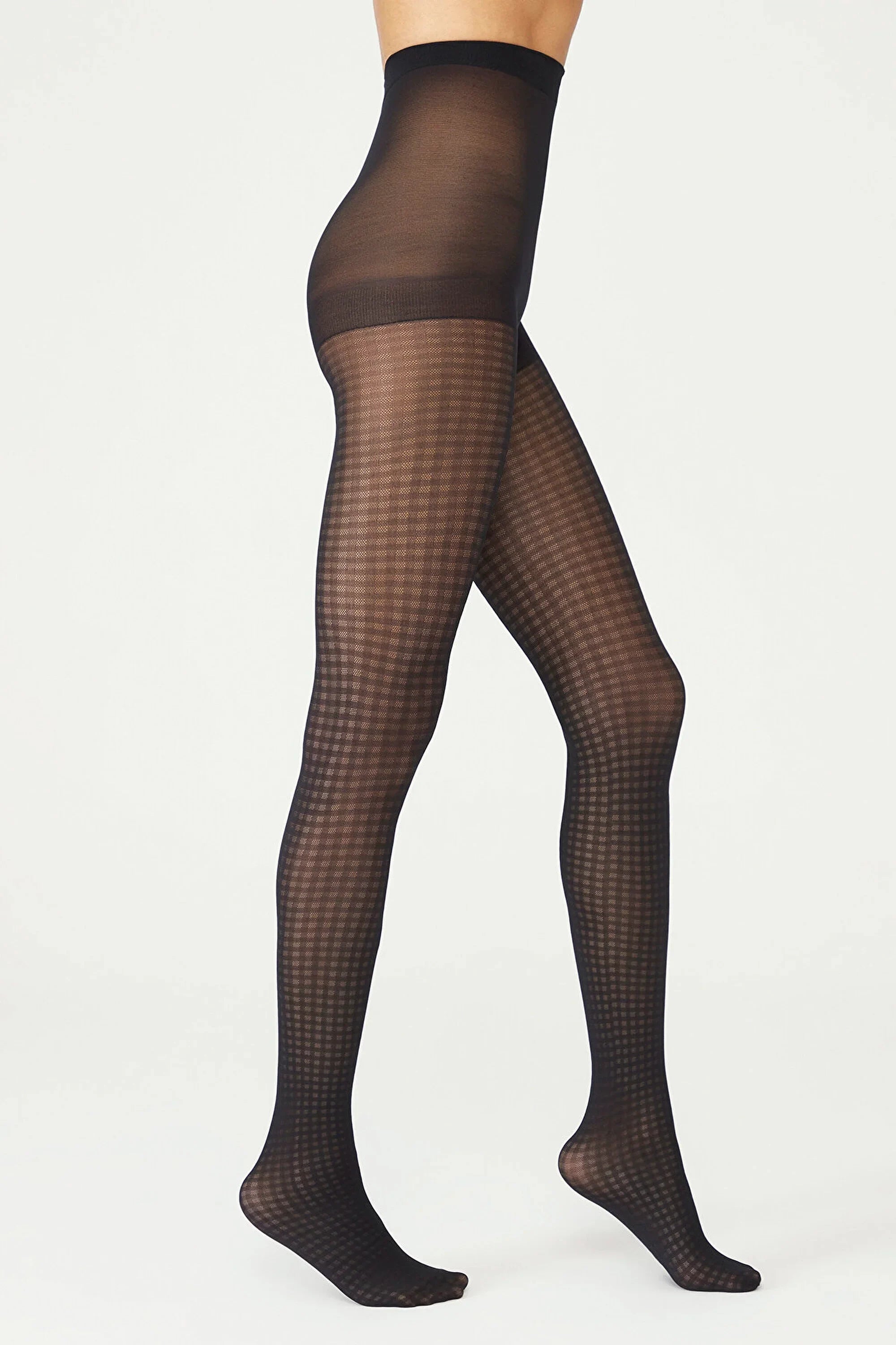 image of woman wearing black gingham patterned pantyhose