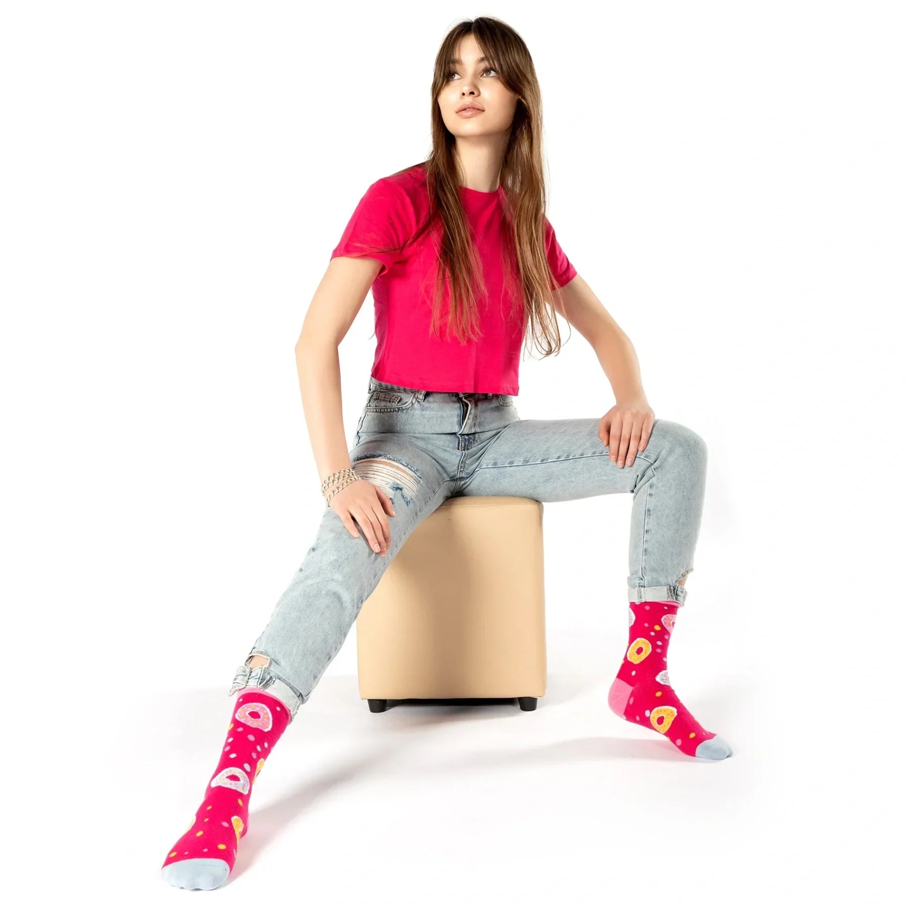 Woman wearing pink doughnut themed socks