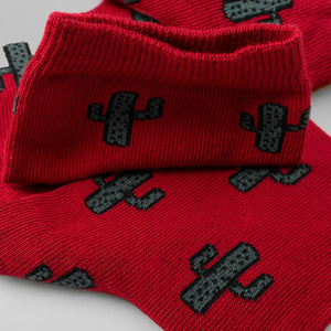 Close-up image of burgundy coloured crew socks with cactus images