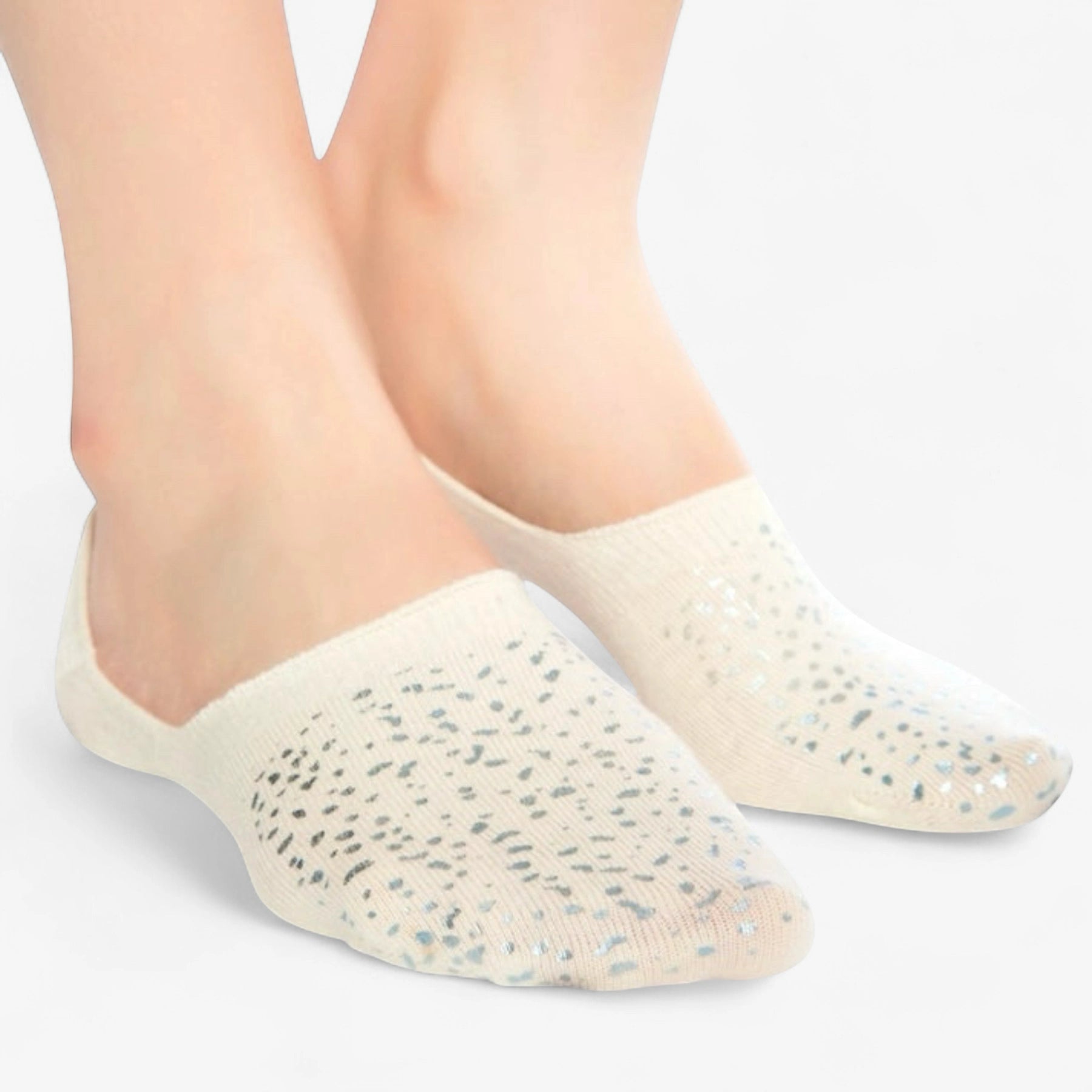 Person wearing ivory coloured no-show, anti-slip socks with sparkly details