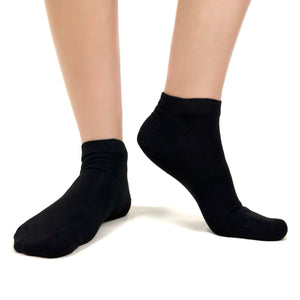 Close image of person wearing black bamboo ankle socks