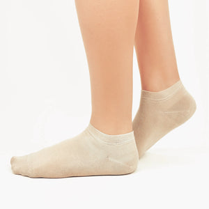 Image of person wearing beige bamboo ankle socks