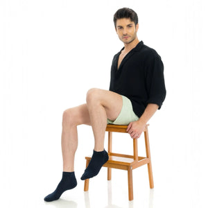 Black bamboo ankle socks worn on model showing comfortable low-cut fit