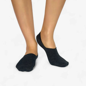 Dark grey organic bamboo no-show socks worn on feet, showing low-cut invisible fit