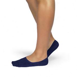 Person wearing navy bamboo no-show socks on a white background