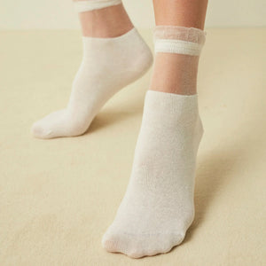 Person wearing ivory colour socks with sheer tule cuff
