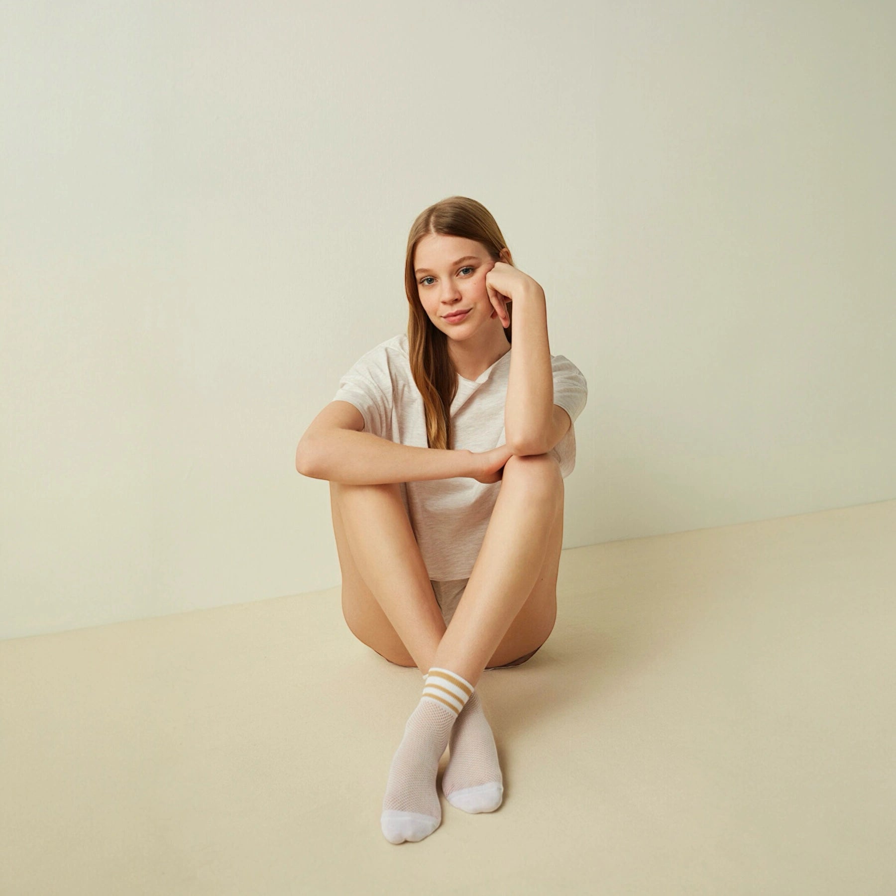 woman wearing white and beige open-weave socks
