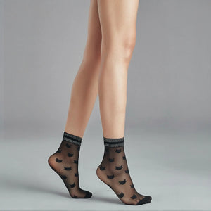 person wearing sheer black quarter length socks with cat detail