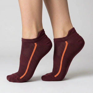 Burgundy ankle socks with mesh design worn by a person on a light gray background