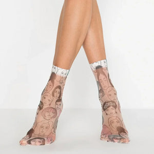 Sheer patterned ankle socks with face designs worn by a person on a white background
