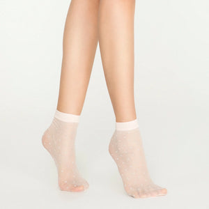 Woman's legs showing sheer white quarter length socks with small silver detail