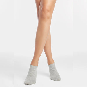 Person wearing silver grey ribbed ankle socks
