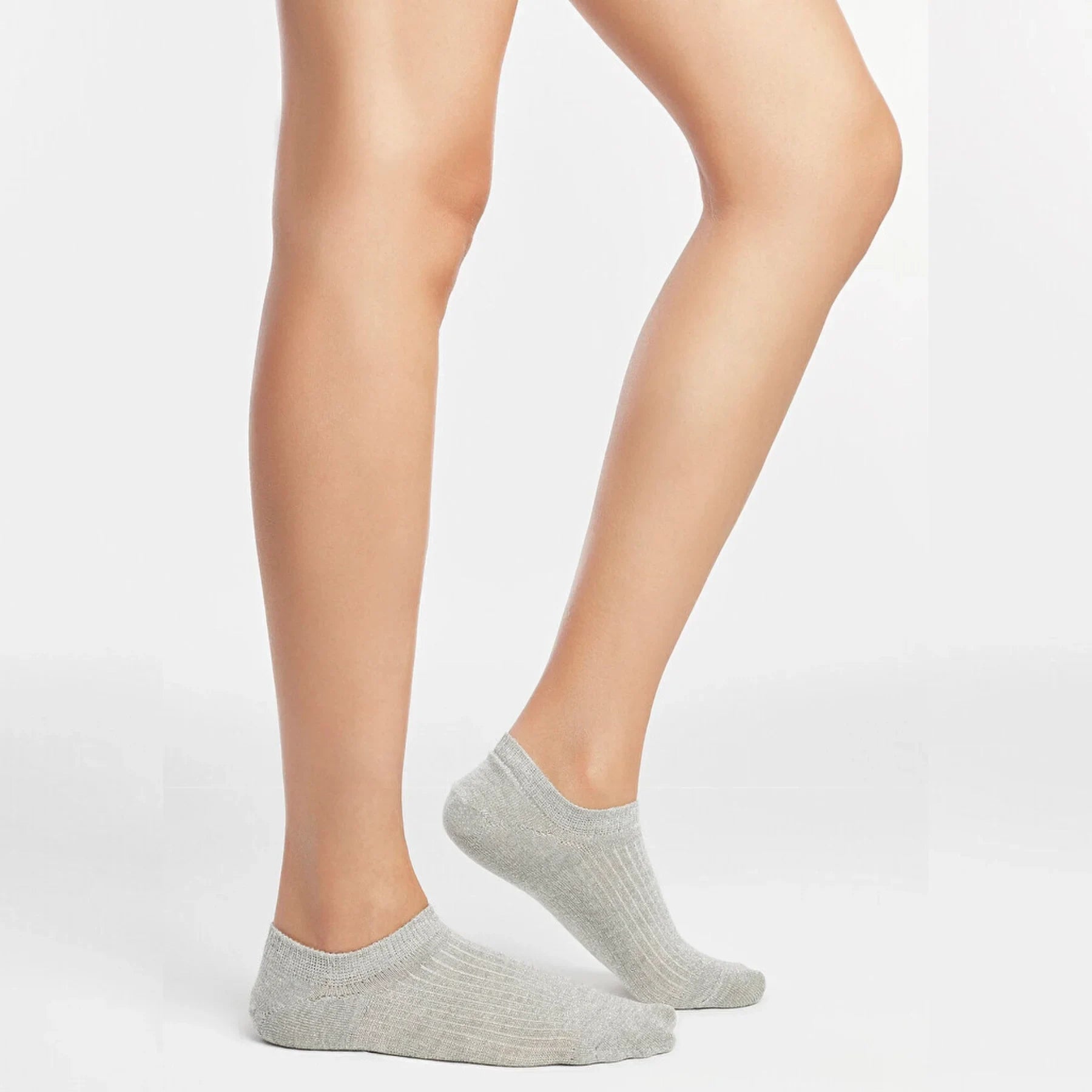 Person wearing silver grey ribbed ankle socks