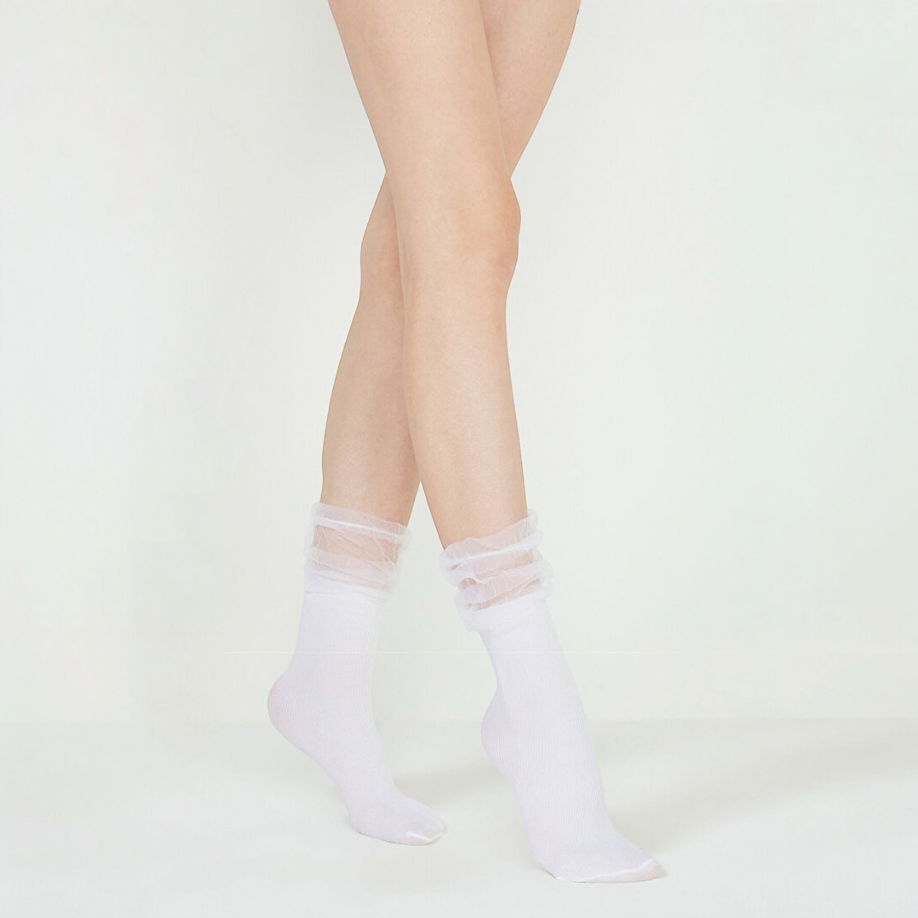 woman wearing white crew socks with baggy tule cuff
