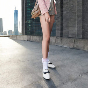 woman wearing white crew socks with baggy tule cuff