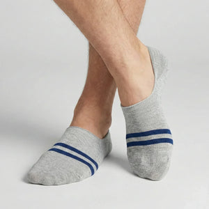 Grey no-show socks with blue stripes worn by a person on a light background
