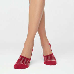 Person wearing red no-show socks with fine stripes