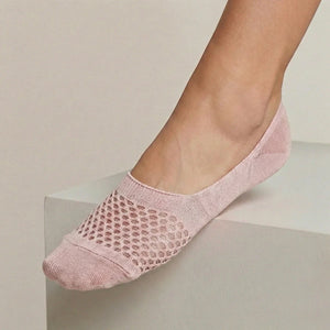 Rose no-show sock with open-weave design worn against a light background