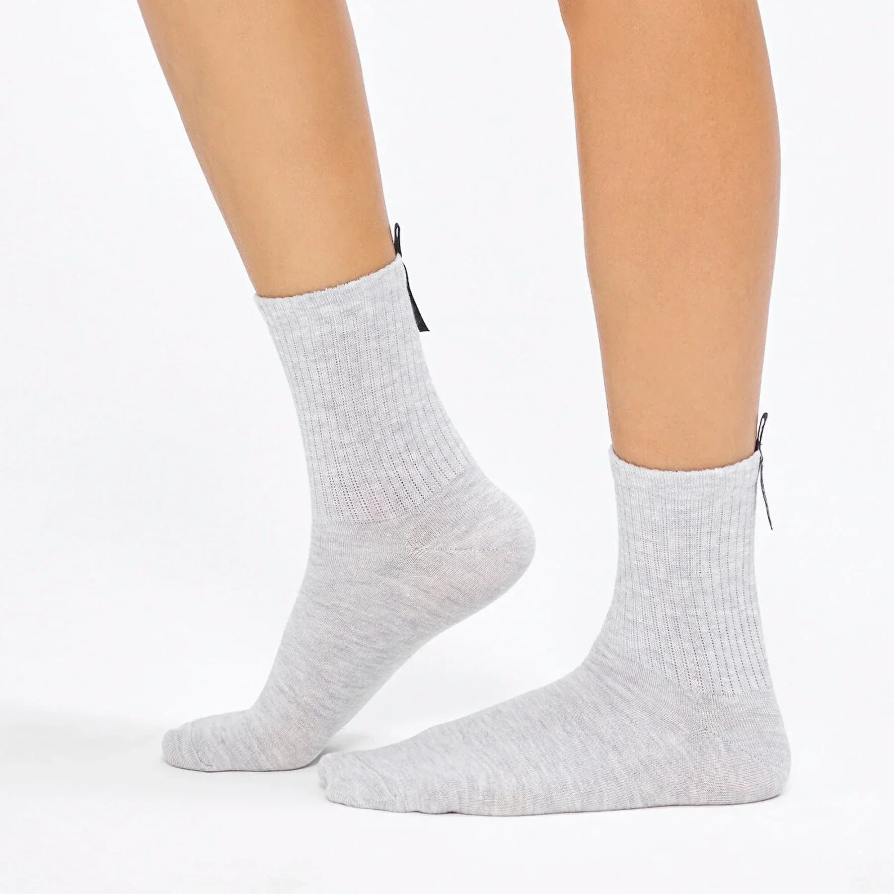 Uniq Socks Australia light grey crew socks with ribbed texture, shown on feet, luxury comfort