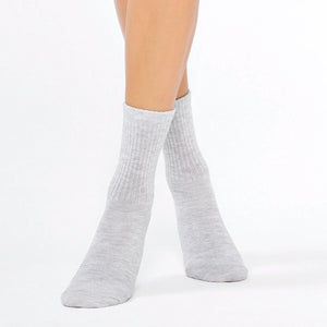 Woman wearing light grey ribbed crew socks made from premium organic bamboo by Uniq Socks Australia
