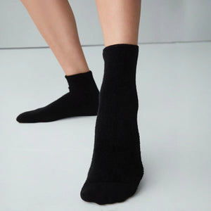 Woman wearing black socks with soft comfy front