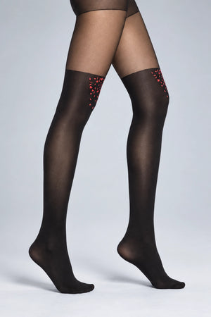 Woman wearing tights shaded darker up to thigh high with red confetti detail