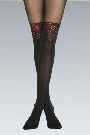 Woman wearing tights shaded darker up to thigh high with red confetti detail