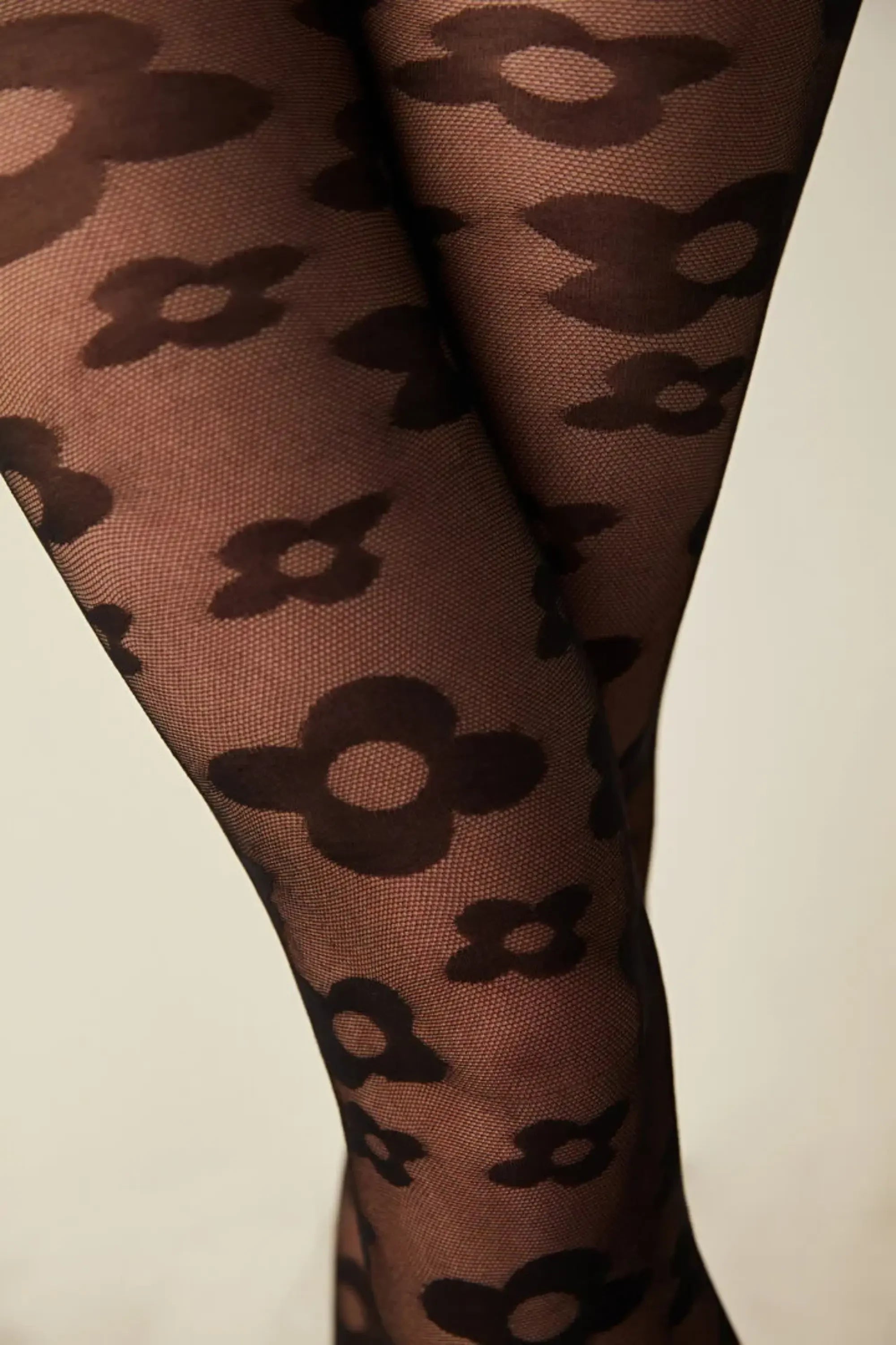 Sheer black fashion tights with large daisy pattern, Uniq Socks Australia luxury hosiery