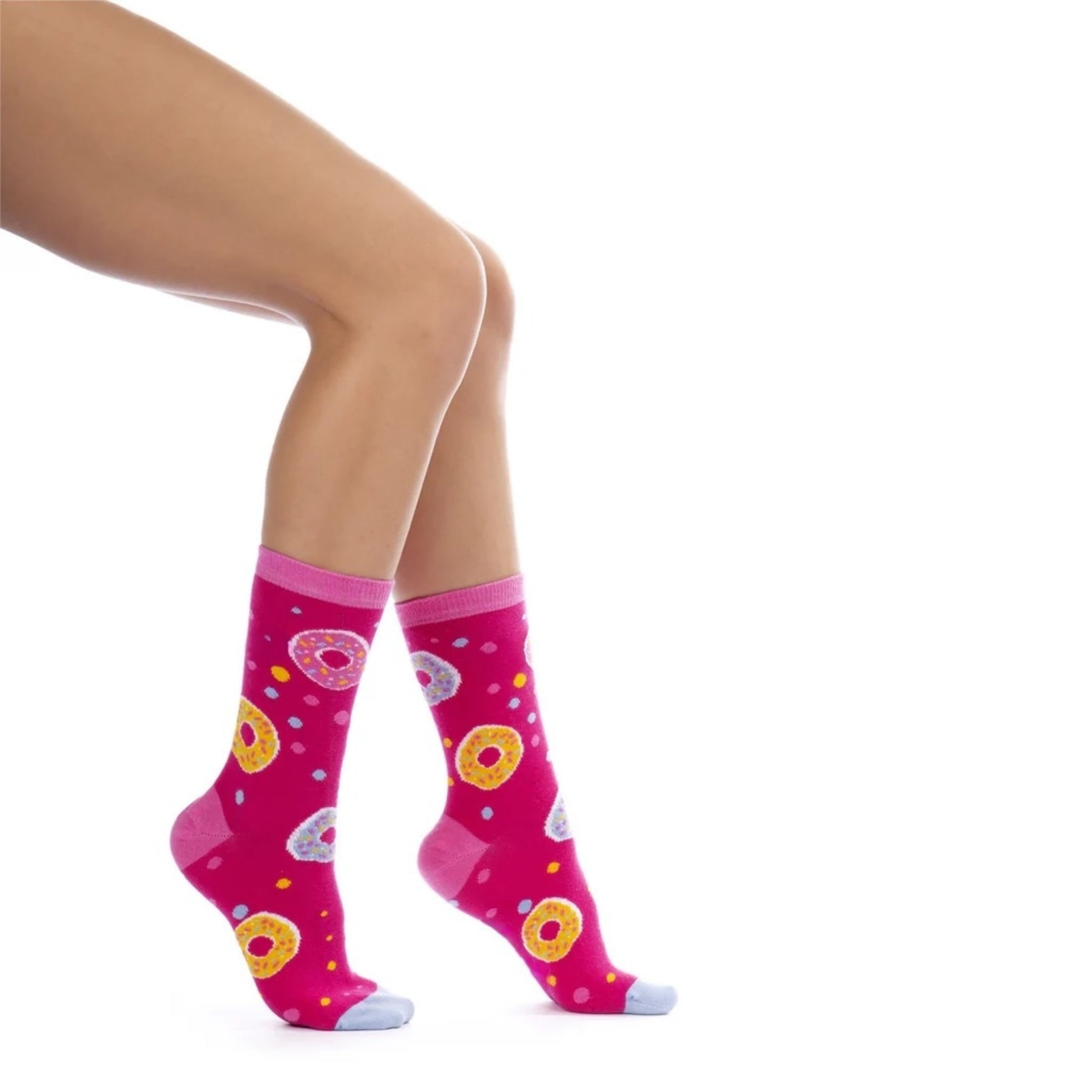 Woman wearing pink doughnut themed socks