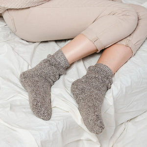Person wearing light tan Norwegian wool socks