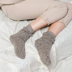 Person wearing light tan Norwegian wool socks