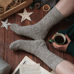 Person wearing light tan Norwegian wool socks