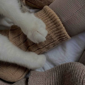 Person wearing beige alpaca and merino wool socks