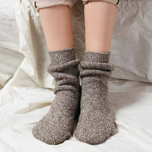 Person wearing light tan Norwegian wool socks