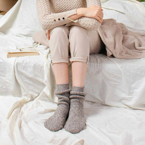 Person wearing light tan Norwegian wool socks