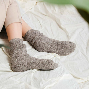 Person wearing light tan Norwegian wool socks