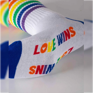 close-up photo of 'love wins'-themed crew socks