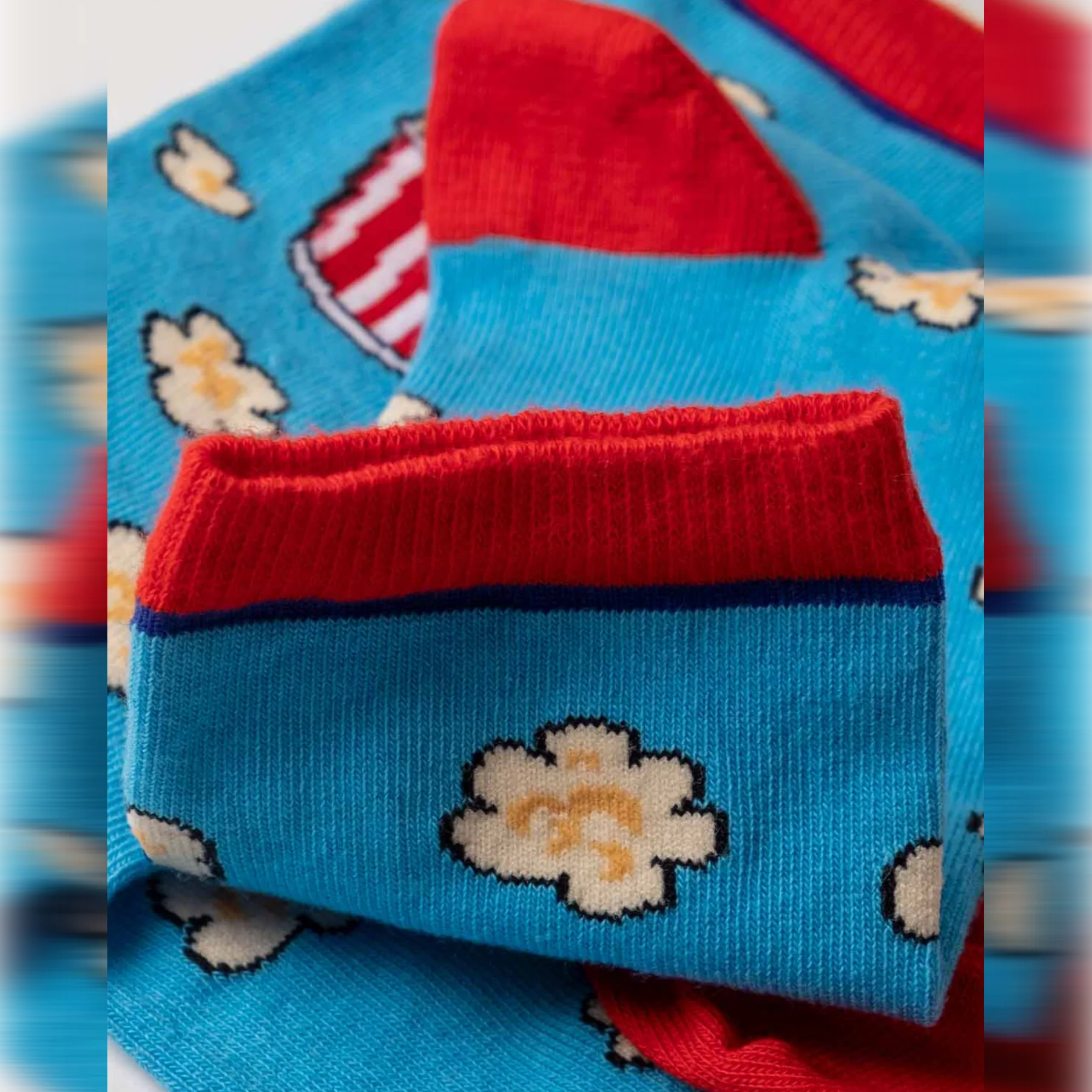 photo of light blue popcorn-themed crew socks