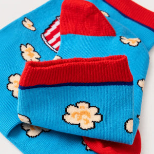 photo of light blue popcorn-themed crew socks