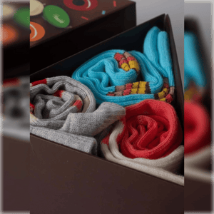 photo of 3 pairs of assorted cake-themed crew socks in gift box