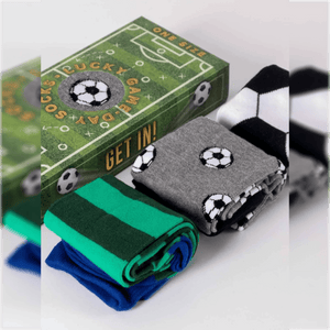photo of 3 pair of assorted soccer-themed crew socks with soccer field-shaped gift box