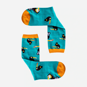 photo of turquoise crew socks with toucan images