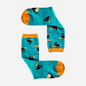 photo of turquoise crew socks with toucan images