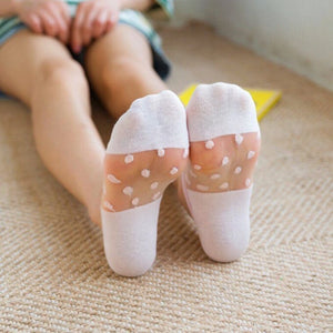 person wearing sheer white no-show socks with white dots