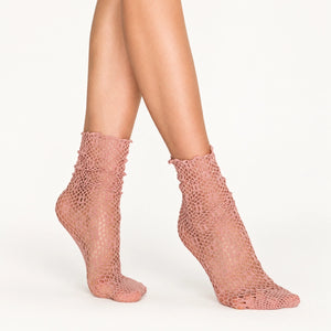 person wearing baggy nude coloured quarter length socks lace inspired
